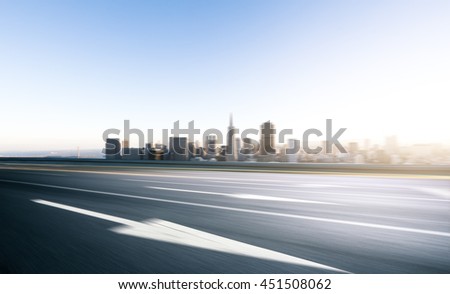 cityscape and skyline of san francisco at sunrise on view from empty asphalt road