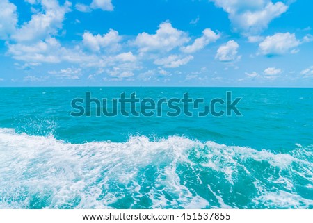 Trail on sea water surface behind  boat