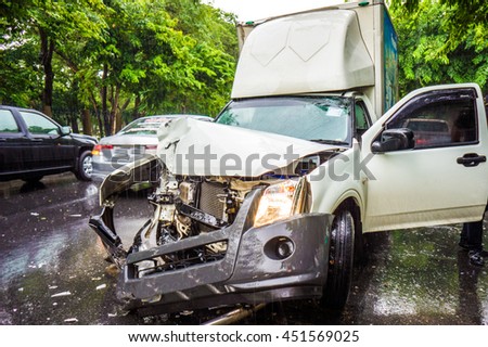 Pick up car crash accident on city street after rainy, Damaged automobiles