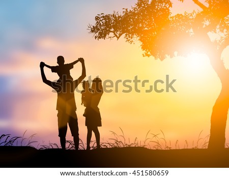 Silhouette  People family consisting of his mother and father were riding neck carries daughter. The family enjoyed a holiday Holiday over blurred beautiful nature.Concept  People and family.