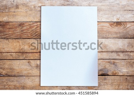 Blank paper on the wooden floor