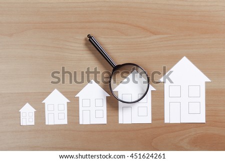 paper house with Magnifying Glass