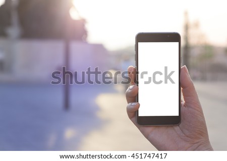 Woman hand holding contemporary modern smartphone. Visual effects. Blank display replaceable with needed design.Vertical mockup