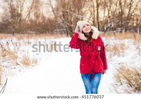 Beauty Winter Girl in frosty winter Park. Outdoors  . woman enjoy snow 