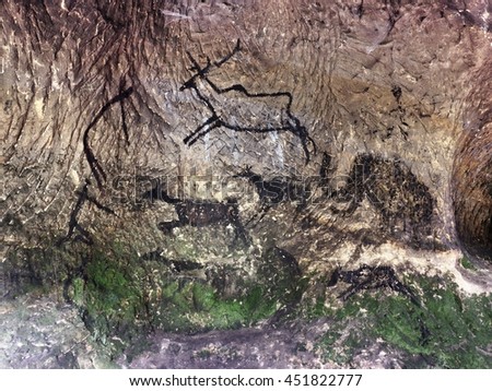 Abstract children art in cave. Black carbon paint of human hunting on sandstone wall, copy of prehistoric picture.Prehistoric drawings in cave. Bison, mammoth, deer, caveman. Primitive neanderthal art