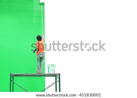 worker is painting green color for green screen studio