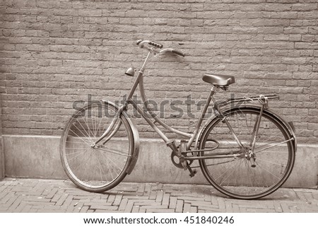 Colorful Bike against Wall, Holland, Netherlands in Black and White Sepia Tone