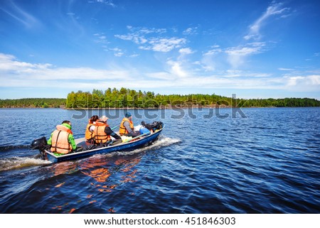 Motor boat with people on a lake
