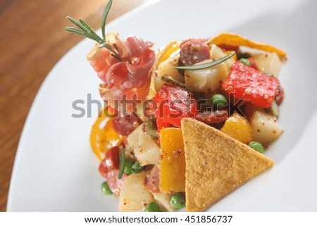 salad in mexican style on white plate