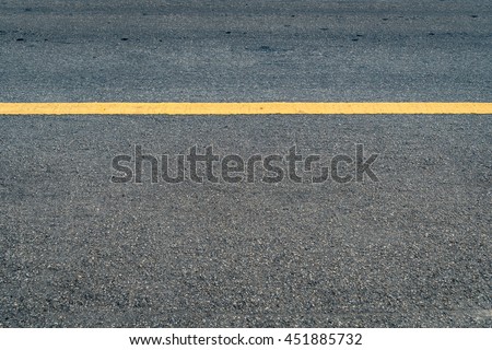 Asphalt road with yellow sign line