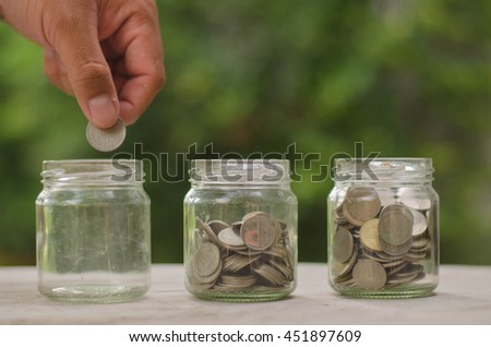 Filling up coins to glass for investment in the future