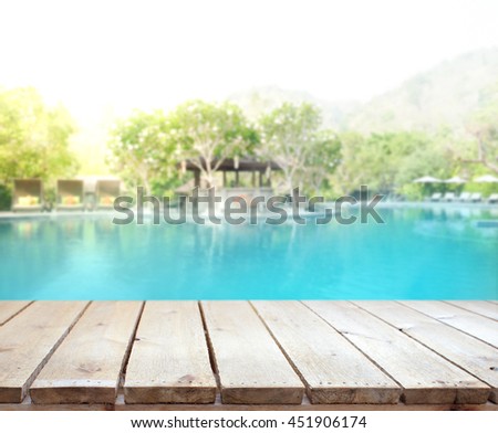 Wood Table Top Of The Background And Pool