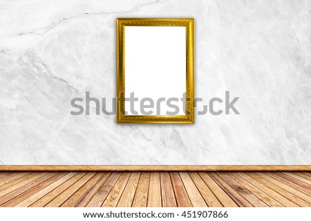 Blank photo frame at the wall 