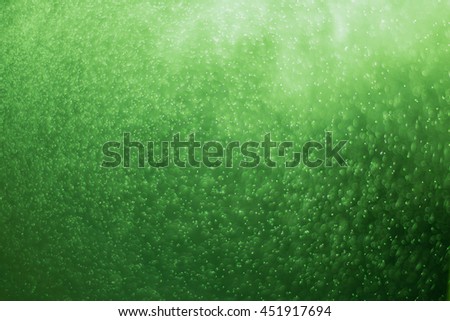 abstract of green light particle and glitter bokeh. image is blurred