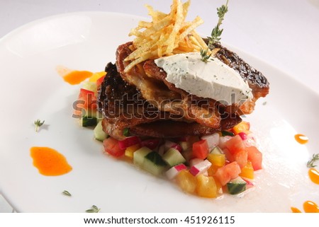 fried fish on vegetables on plate