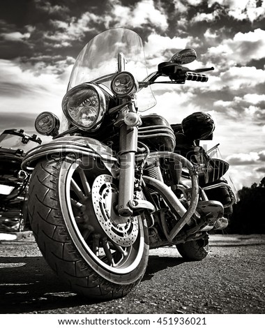 Freedom.Motorbike under sky.Vintage photo effect added for create atmosphere Royalty-Free Stock Photo #451936021