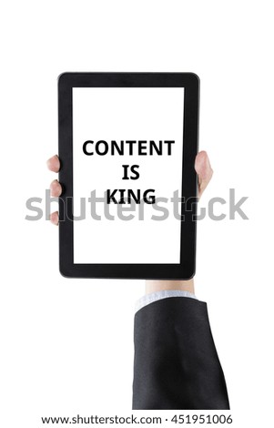 hand of businessman holding digital tablet with word content is king isolated on white background with clipping path