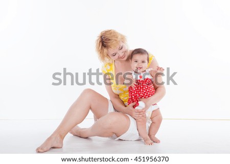 Mama embraces his cute daughter family happy