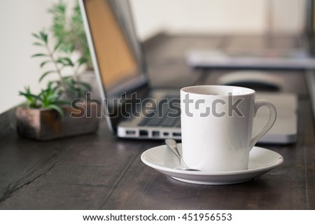 Mug Coffee on wooden work table. Royalty-Free Stock Photo #451956553