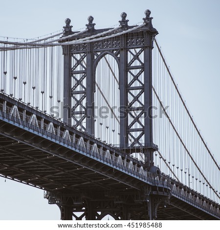 Suspension bridge on east river of New York, warm filter