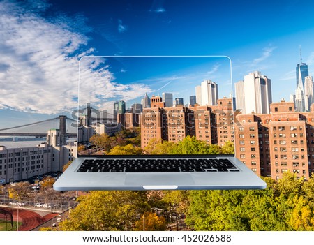 Viewing Downtown Manhattan with laptop, New York