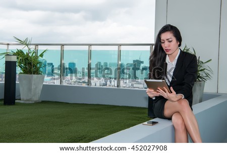 Tablet computer. Woman using digital tablet computer PC happy isolated on white background. Focus on both tablet and face. Beautiful  / Caucasian woman in business shirt.