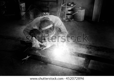 Man welding work,Welding steel sparks,Black and white