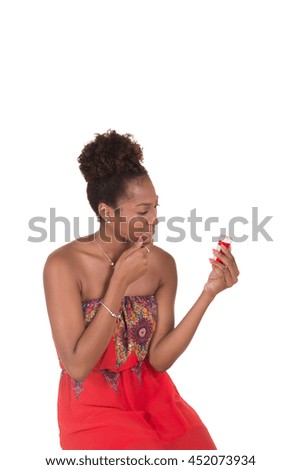 Young woman reading the label on a pill bottle