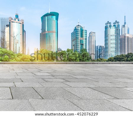 empty pavement and modern buildings in city