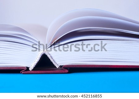 Open book on light table. Back to school. Copy space