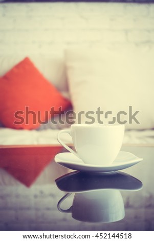 White coffee cup on table decoration in living room interior - Vintage Filter