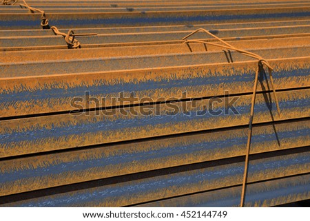 steel plate banding piled up together, closeup of photo