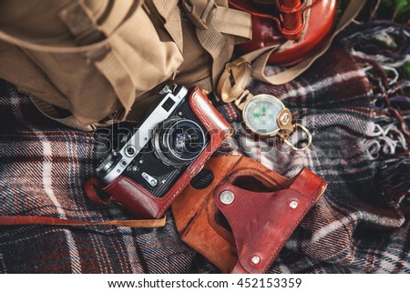 Travel set, blanket are vintage compass, camera, canteen and a flashlight