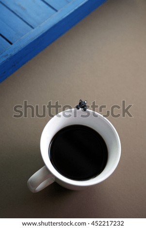 Coffee mug on brown background