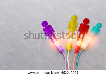 CONNECTING PEOPLE CONCEPT WITH CABLE AND PEOPLE PAPER CUT STYLE on grey Background Royalty-Free Stock Photo #452240095