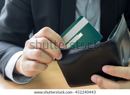 business man bring credit card out  from wallet
 Royalty-Free Stock Photo #452240443