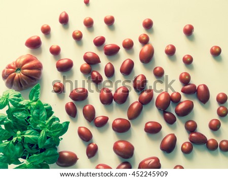 Vintage cherry tomatoes and beef hearts with basil Leaves