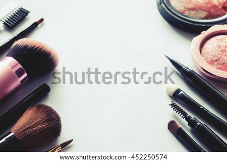 Various makeup products on white background with copy space.vintage tone