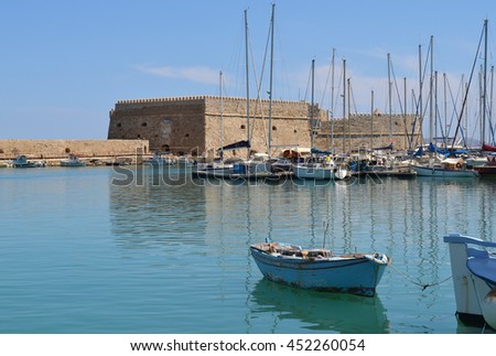 Old Venetian Harbor in Heraklion, Crete, Greece with Koules Fort in the background