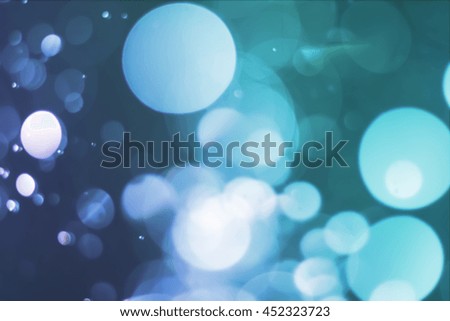 abstract blurred light bokeh on blue gradient background