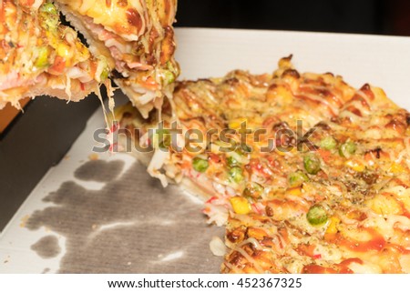 Close up scene : Taking Slices Of Pizza in Italian Restaurant, Fast Food - Slice of pizza margarita lifted up

