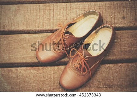 Vintage shoes on wooden floor 
