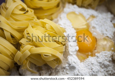 Italian Pasta with flour on the wooden table at the kitchen  - food picture