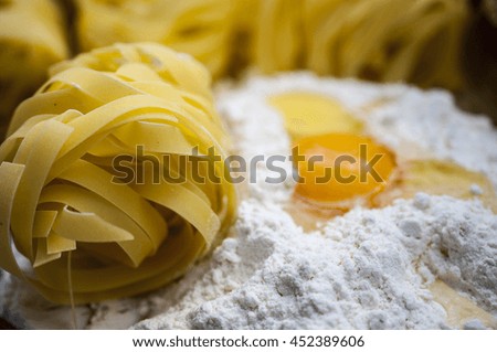 Italian Pasta with flour on the wooden table at the kitchen  - food picture