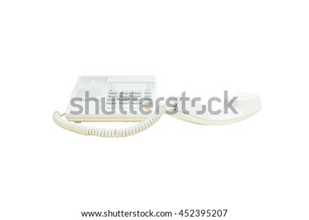 Closeup white phone , office phone in the meeting room isolated on white background