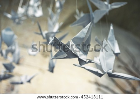 Paper origami cranes. Business concept. Postcard greeting card inspiration. 