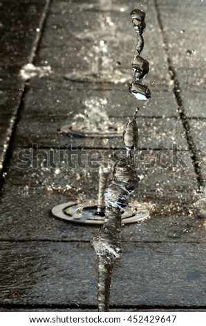Picture of a Water stream splashing . Summer theme