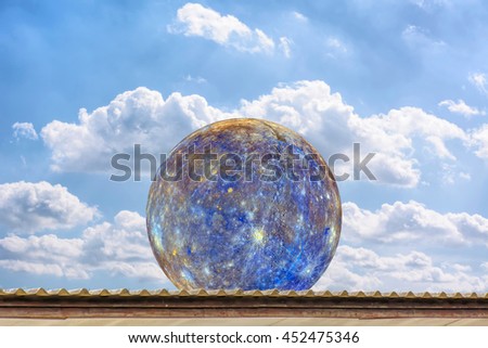 Planet Mercury on the roof, on the blue sky. Elements of the furnished by NASA.