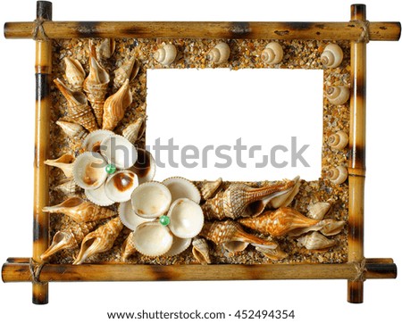 Photoframework from sea cockleshells on white background