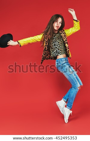 young teenage-girl dancing in laserbeam-discolight